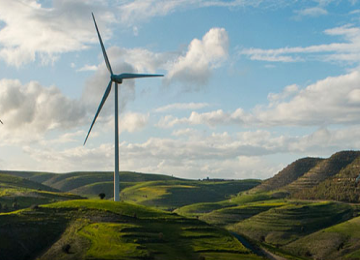 A Wind Turbine on top of the Mountains